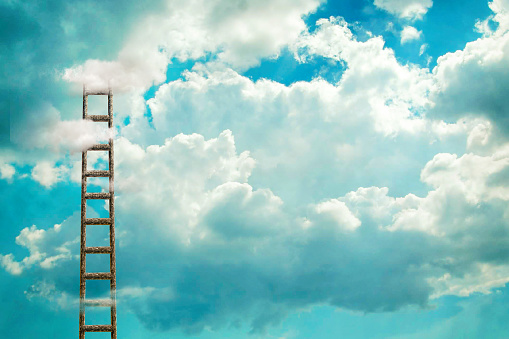 Staircase to the cloudy sky. Growth concept. Success. Achievement of the goal. Copy space. Business. Lifestyle. Abstract background. Background.