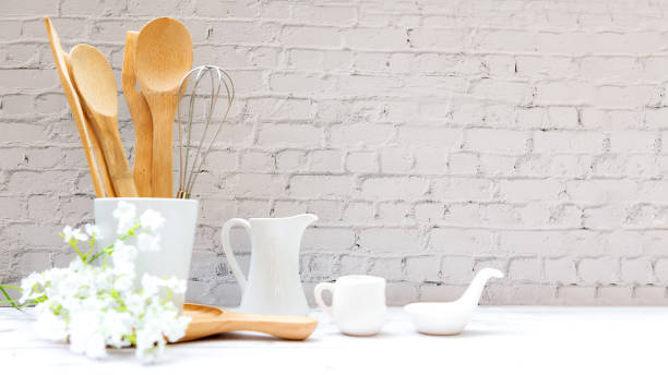 istock Kitchen tools and kitchenware utensil object on kitchen shelf wood white for healthy eat and health care life.  Wall white brick background, copy space for text 1319593616
