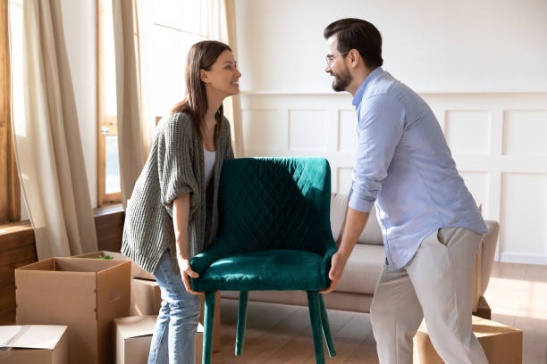 istock Happy couple settle in new home relocating 1319593745