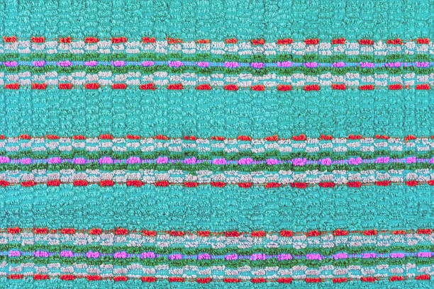 istock old turquoise towel with horizontal stripes ornament - flat background and texture 1319594106