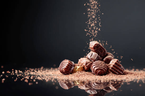 istock Chocolate candies on a black background. 1319598444