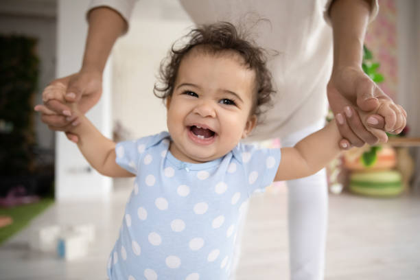 istock Portrait of cute ethnic baby learn walking 1319599195