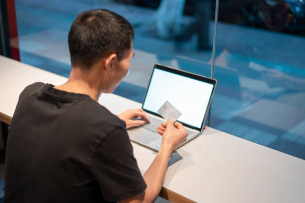 istock Man using credit card for online shopping 1319602690