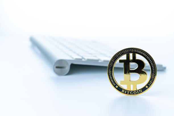 istock Trade bitcoin. Golden Bit Coin virtual cryptocurrency or blockchain technology. Gold Crypto currency BTC Bitcoin with keyboard on white background. Block chain, network connect concept. 1319605486