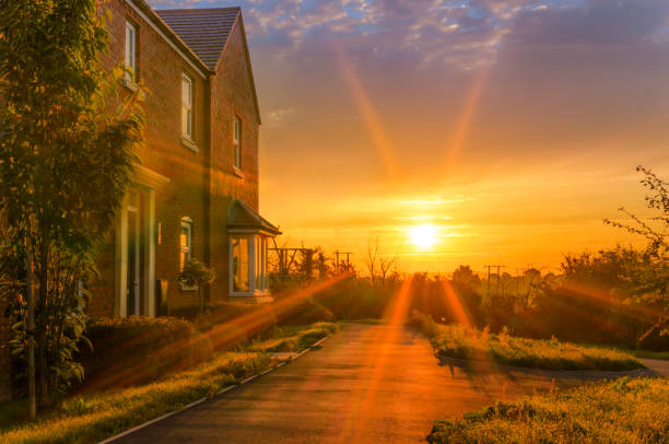 Idyllic Country House At Sunrise Sun Rises Over Remote Country House. Herefordshire Barley Field, United Kingdom house landscaped beauty in nature horizon over land stock pictures, royalty-free photos & images