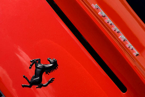 Ferrari Horse Logo Close Up on Red Car Background stock photo