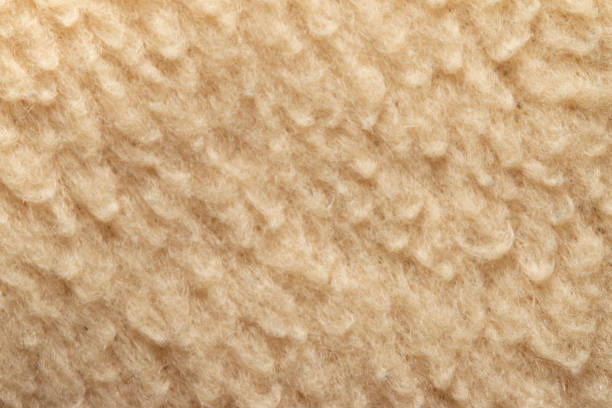 istock Beige wool fabric close-up, background material 1319613222