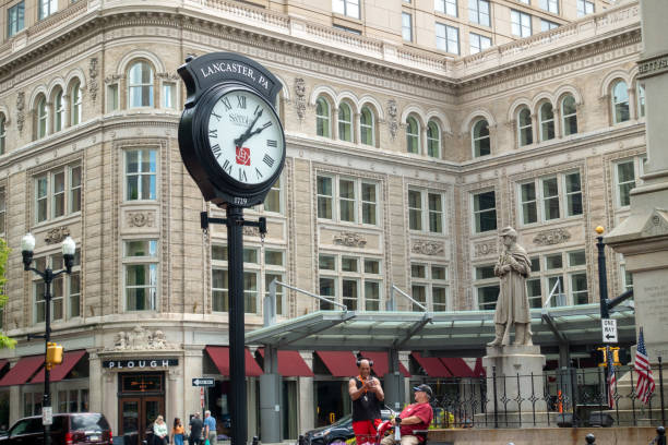 Lancaster, USA - May 15, 2021. Two men chatting  at town square in downtown Lancaster city, Pennsylvania, USA