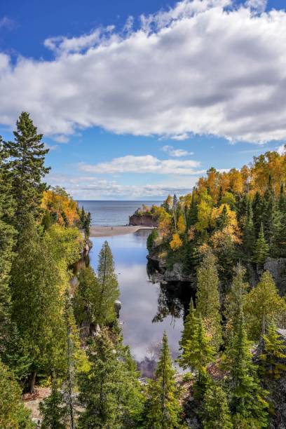 istock Clouds reflecting on Baptism River in Autumn at Tettegouche State Park, Minnesota 1319615017