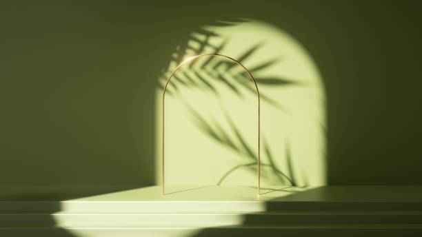 istock 3d render, abstract green background. Empty stage with steps, leaves shadows and bright sunlight. Minimal scene with golden round arch, showcase for product presentation 1319617346