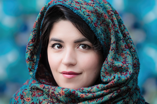 Portrait of a beautiful Tatar muslim woman in a headscarf near the blue mosque.