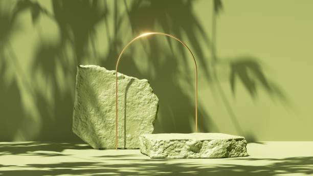 istock 3d render, abstract green background with tropical leaves shadow and bright sunlight. Minimal scene with cobble stone platform and golden arch for cosmetic product presentation 1319617900