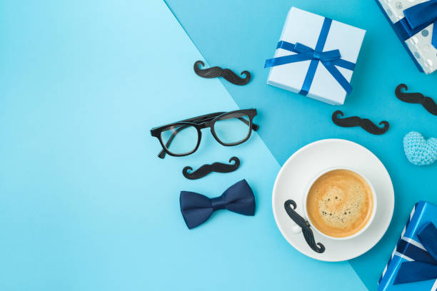 istock Happy Fathers day concept with coffee cup,  tie bow and gift box on blue background 1319618692