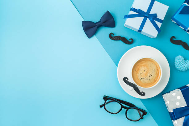 istock Happy Fathers day concept with coffee cup,  tie bow and gift box on blue background 1319618696