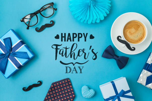 istock Happy Fathers day concept with coffee cup,  tie bow and gift box on blue background 1319618706
