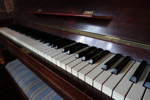 color photo of the keyboard of an acoustic piano