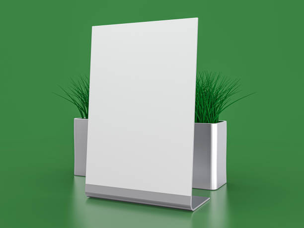 istock Blank paper Table Tent. Mockup on green background. 3D illustration. 1319621644