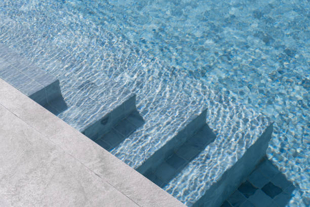 part of swimming pool with blue water stock photo