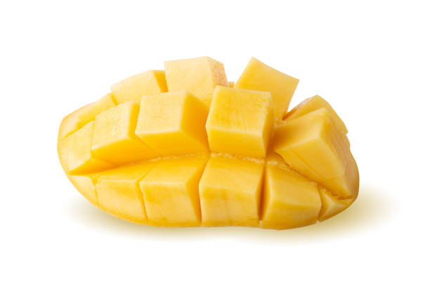 istock Rip mango slice cubes cut, Mango half cut in cubes, Fresh juicy mango fruit isolated on a white background. 1319624390