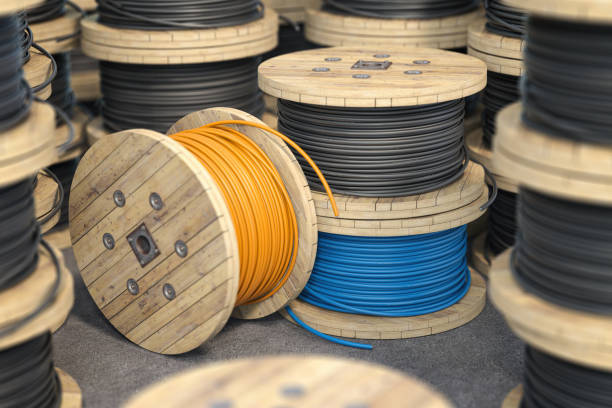 Wire electric cable on wooden coil or spool isolated on warehouse. Wire electric cable on wooden coil or spool isolated on warehouse. 3d illustration wooden spool stock pictures, royalty-free photos & images