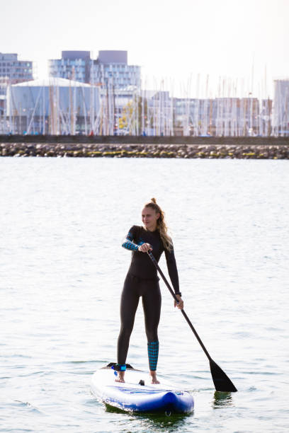 istock Female SUP paddle-boarding in ocean 1319626190