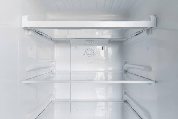 inside of clean and empty refrigerator with shelves. Close up. stock photo