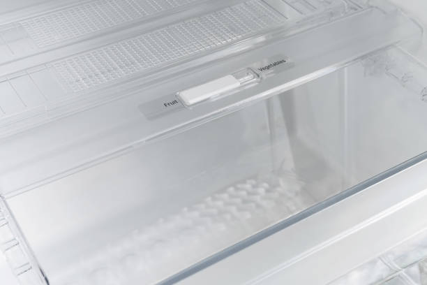 istock inside of clean and empty refrigerator with shelves. Close up. 1319627008