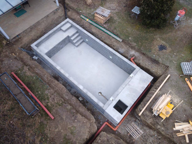 istock Drone photo of pool construction site in a garden 1319628310