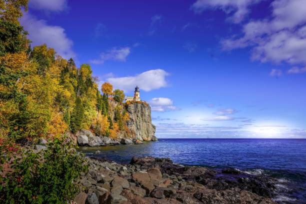 istock Split Rock Lighthouse on Lake Superior rocky shoreline on sunny day 1319628317