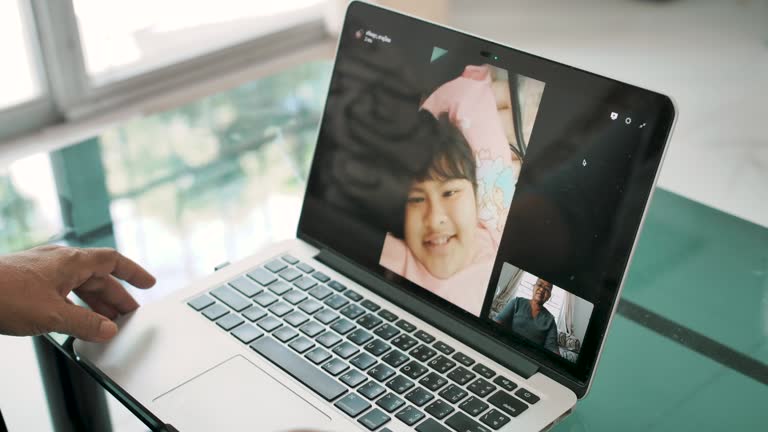 Woman using a laptop to video chat