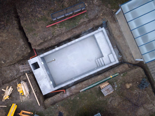 istock Drone photo of pool construction site in a garden 1319628577