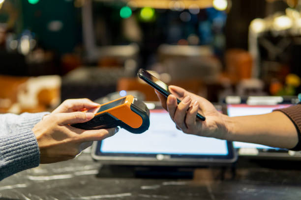 istock Payment with smartphone on credit card payment machine 1319628731