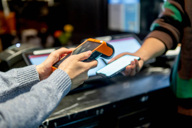 istock Payment with smartphone on credit card payment machine 1319628760
