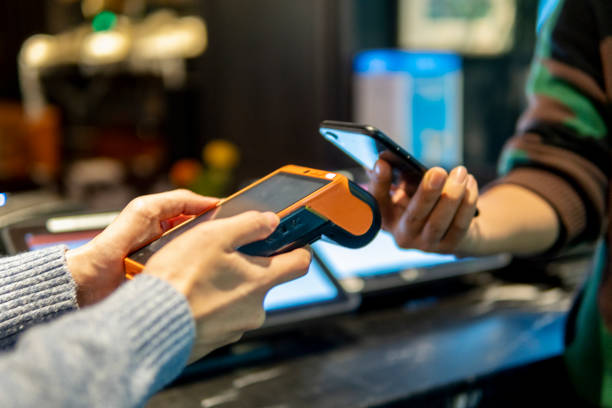 istock Payment with smartphone on credit card payment machine 1319628763