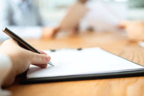 istock Woman Signing Contract Paper 1319628798