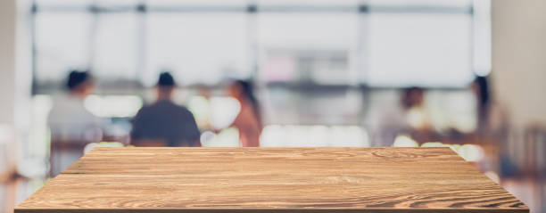 istock wooden perspective table with blur co working space with people background.banner mockup advertise for product display backdrop 1319631387