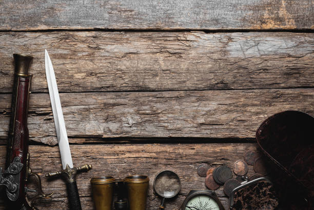 Pirate. Pirate concept flat lay background with copy space. Pirate equipment on the old wooden table. wallet gun stock pictures, royalty-free photos & images