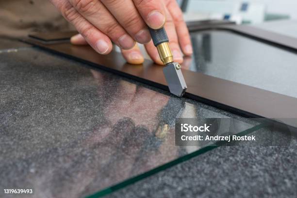 The Glazier Cuts The Glass With A Handheld Cutting Tool Handicraft Plant Close Up Stock Photo - Download Image Now