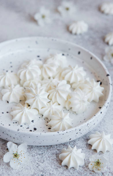 istock Small white meringues in the  ceramic bowl 1319640402