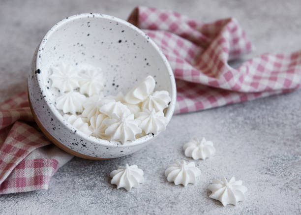 istock Small white meringues in the  ceramic bowl 1319640405