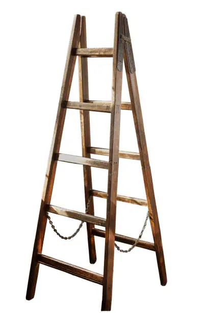 Photo of Wooden ladder isolated on white background. Double ladder with a chain in the middle