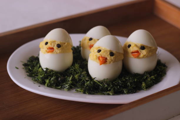 istock Devilled egg chicks prepared as Easter Eggs. Traditional celebration of making eggs as the symbol of new life and resurrection 1319643461