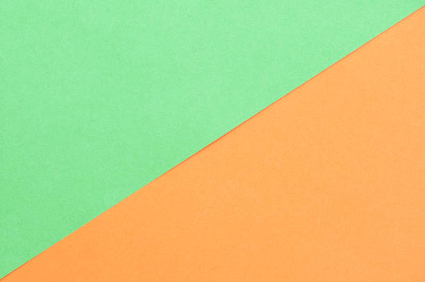 istock Green and orange paper background 1319644593