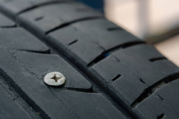 istock Metal screws nails embroidered in tires 1319645470