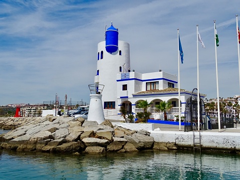 The Marina and lighthouse at Duquesa in Spain viewed from the sea