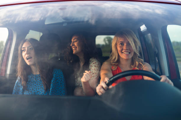 istock Friends singing and dancing in the car 1319649964