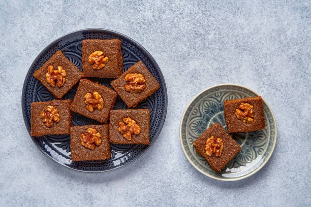 istock Middle eastern walnut semolina cake basbousa , namoora, hareesa . Traditional sweets celebration Eid , Ramadan . Top view with copy space 1319653219