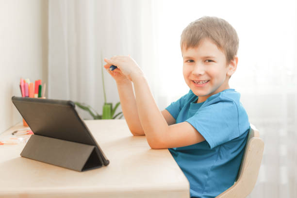 istock Happy little child learning at home 1319653675