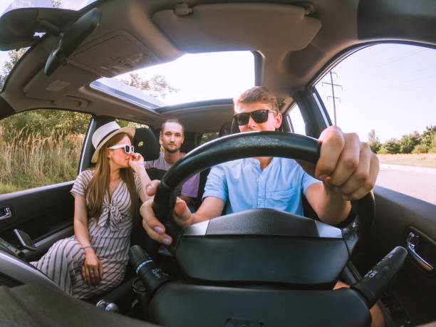 istock group of friends in car 1319654419