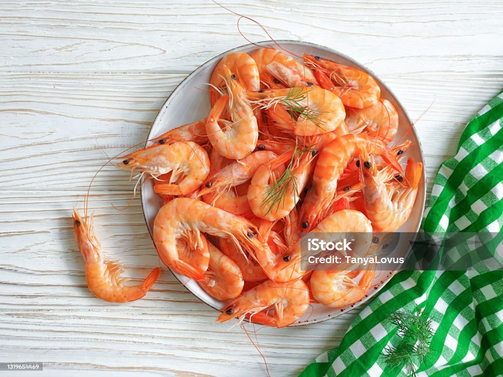 boiled shrimp in a plate on a wooden background Ebi Nigiri Stock Photo
